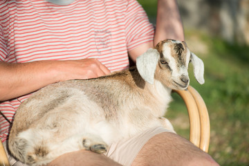 Farmer holding baby got on his lap