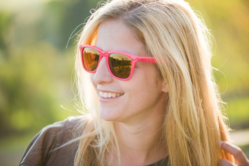 Fashionable girl in sunglasses, close up fashion beautiful woman portrait wearing sunglasses