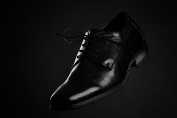 black shoe on black background
