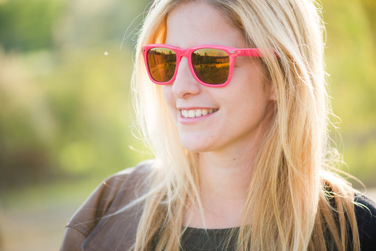 Fashionable girl in sunglasses, close up fashion beautiful woman portrait wearing sunglasses