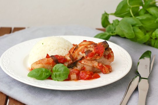 Roasted chicken with basil and tomatoes and rice