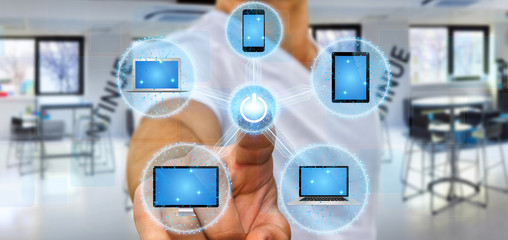 Businessman connecting tech device with his finger