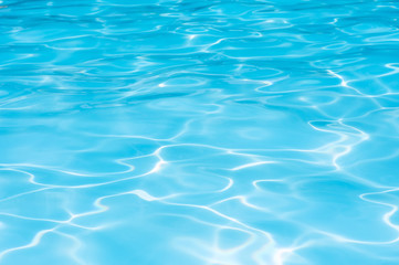 Fototapeta na wymiar Beautiful Gentle wave in swimming pool with sun reflection