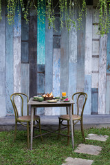 Breakfast outside in garden on vintage wooden table