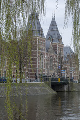 Historical building with museum near the canal in Amsterdam
