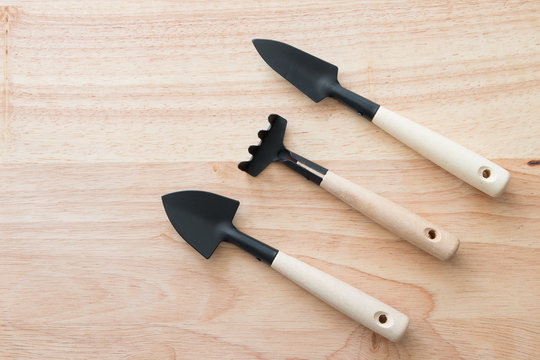 Gardening tools on a wooden board