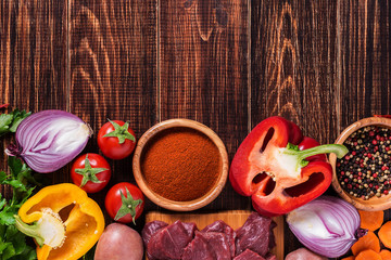 Ingredients for goulash or stew cooking: raw meat,herbs,spices,v