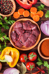 Ingredients for goulash or stew cooking: raw meat,herbs,spices,v