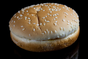 Burger bread texture on black background.