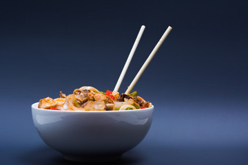 Chinese noodles with a chicken and vegetables