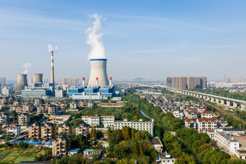 Industrial power plant smoke pollution in urban suburb