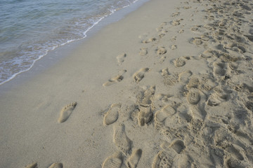 holiday, fine sandy beach with footprints of people on its surfa