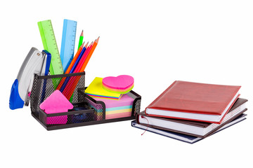 Stationery isolated on white. Notebooks, markers, pencils, rulers, stickers, stapler