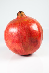 Pomegranate fruit on white background.