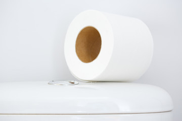 Hygienic paper on white toilet tank