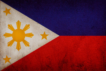 Flag of Republic of the Philippines on old wall texture backgrou