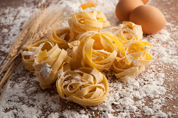 fettuccine pasta italian food still life rustic  close up macro - obrazy, fototapety, plakaty