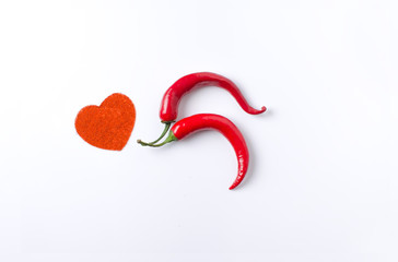 chili pepper on a white background on top in the form of heart