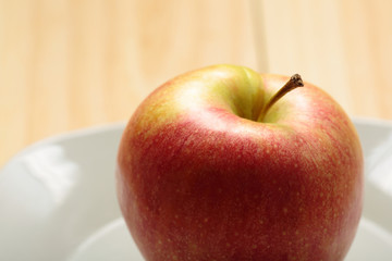 Apple on a white plate