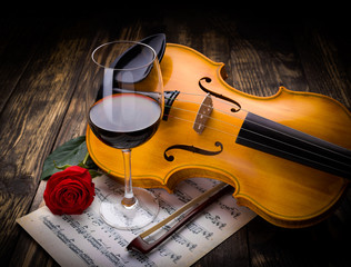 Wine, rose and violin