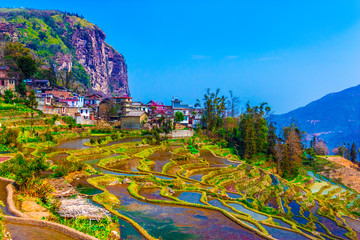 Village in South China with traditional Houses and Rice Terraces
