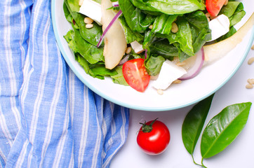 Healthy spinach salad with a top with a cocktail. Authentic fresh salad. Vegetable salad.