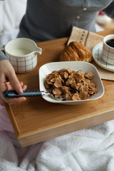 Healthy breakfast in bed with coffee
