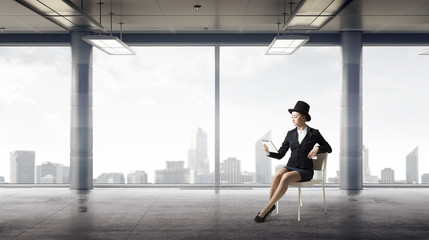 Obraz na płótnie Canvas Businesswoman on chair in office