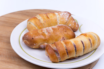 Homemade sweet baked rolls buns copy space over white
