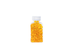 Omega 3 fish oil capsules spilling out of a bottle on a white background