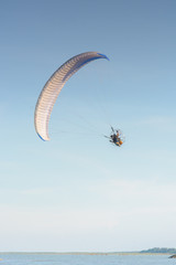 Paramotor on the sky in the evening:Close up,select focus with s