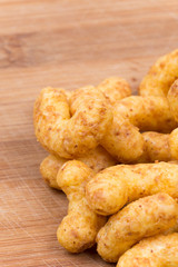 Snacks with peanuts on a wooden board
