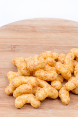 Macro closeup snacks with peanuts on a wooden board