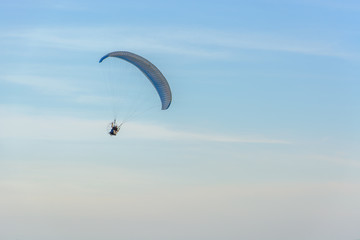 Paramotor on the sky in the evening:Close up,select focus with s
