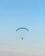 Paramotor on the sky in the evening:Close up,select focus with s