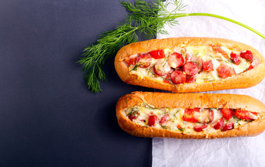 Sausage, tomato and cheese bread boats