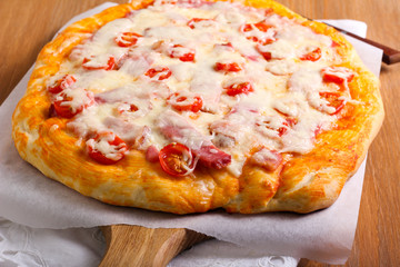 Ham and tomato homemade pizza,