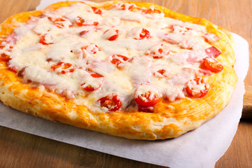 Ham and tomato homemade pizza,