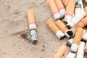 Smoking, for disposable cigarette on sand