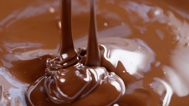 dark melted chocolate drips and flow, 180fps footage