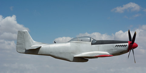 P-51 Mustang fighter against a clear blue sky
