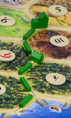 The concept of the road to owning a smaller house and later a bigger house, illustrated with the help of the popular board game, Settlers of Catan.