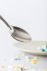 Pills on a spoon (selective focus)