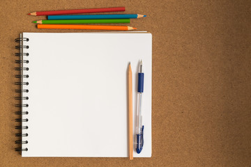 Spiral open sketchbook with color pencils