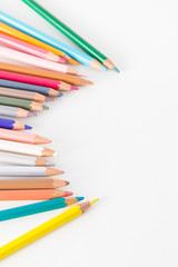Closeup of Colour pencils on white background, selective focus