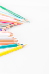 Closeup of Colour pencils on white background, selective focus