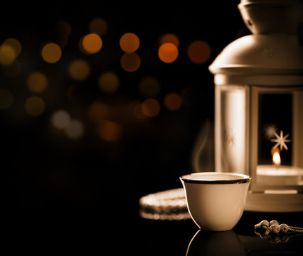 Close up on an Arabian coffee with Lantern and rosary..