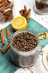 Spices and herbs. allspice on table, wooden board