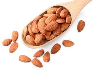 dried almonds in wooden spoon