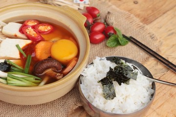 Making Korean tofu soup delicious.